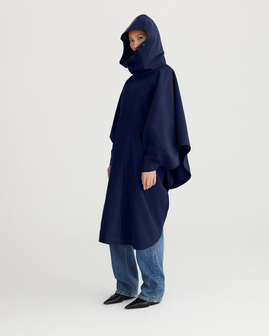 Navy blue, waterproof, breathable, technical, sustainable and packable raincoat poncho suitable for cycling